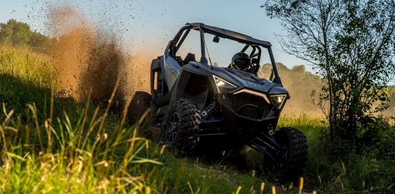 A Polaris RZR drives around a track in rural Minnesota